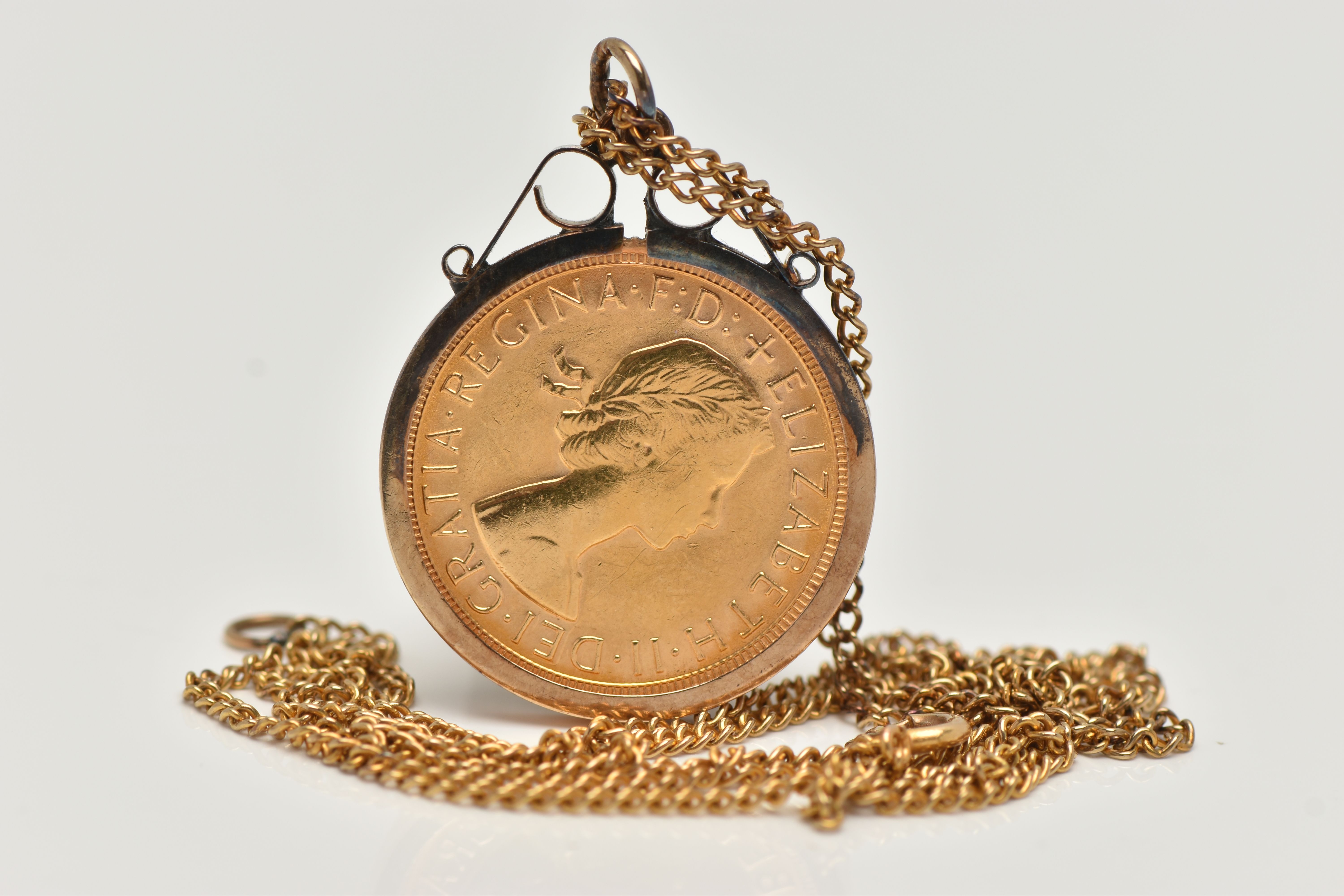 A FULL SOVEREIGN COIN IN A 9CT GOLD MOUNT, a full sovereign depicting George and the Dragon 1968, - Image 2 of 2