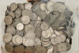 A HEAVY PLASTIC TUB CONTAINING MID 20TH CENTURY COINS, mainly Florins, Shillings, Sixpence coins