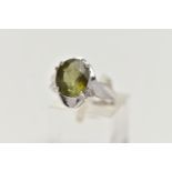A 9CT WHITE GOLD, TOURMALINE AND DIAMOND RING, designed with an oval cut green tourmaline in a