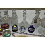 A COLLECTION OF CUT GLASS DECANTERS AND STUDIO GLASS PAPERWEIGHTS, comprising a Nailsea glass