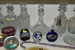 A COLLECTION OF CUT GLASS DECANTERS AND STUDIO GLASS PAPERWEIGHTS, comprising a Nailsea glass