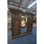 AN EARLY 20TH CENTURY HAMPTON AND SONS OF PALL MALL EAST LONDON, CARVED OAK COMPACTUM WARDROBE,