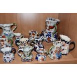 A COLLECTION OF IRONSTONE JUGS, comprising a large pitcher in Basket Japan pattern with a serpent