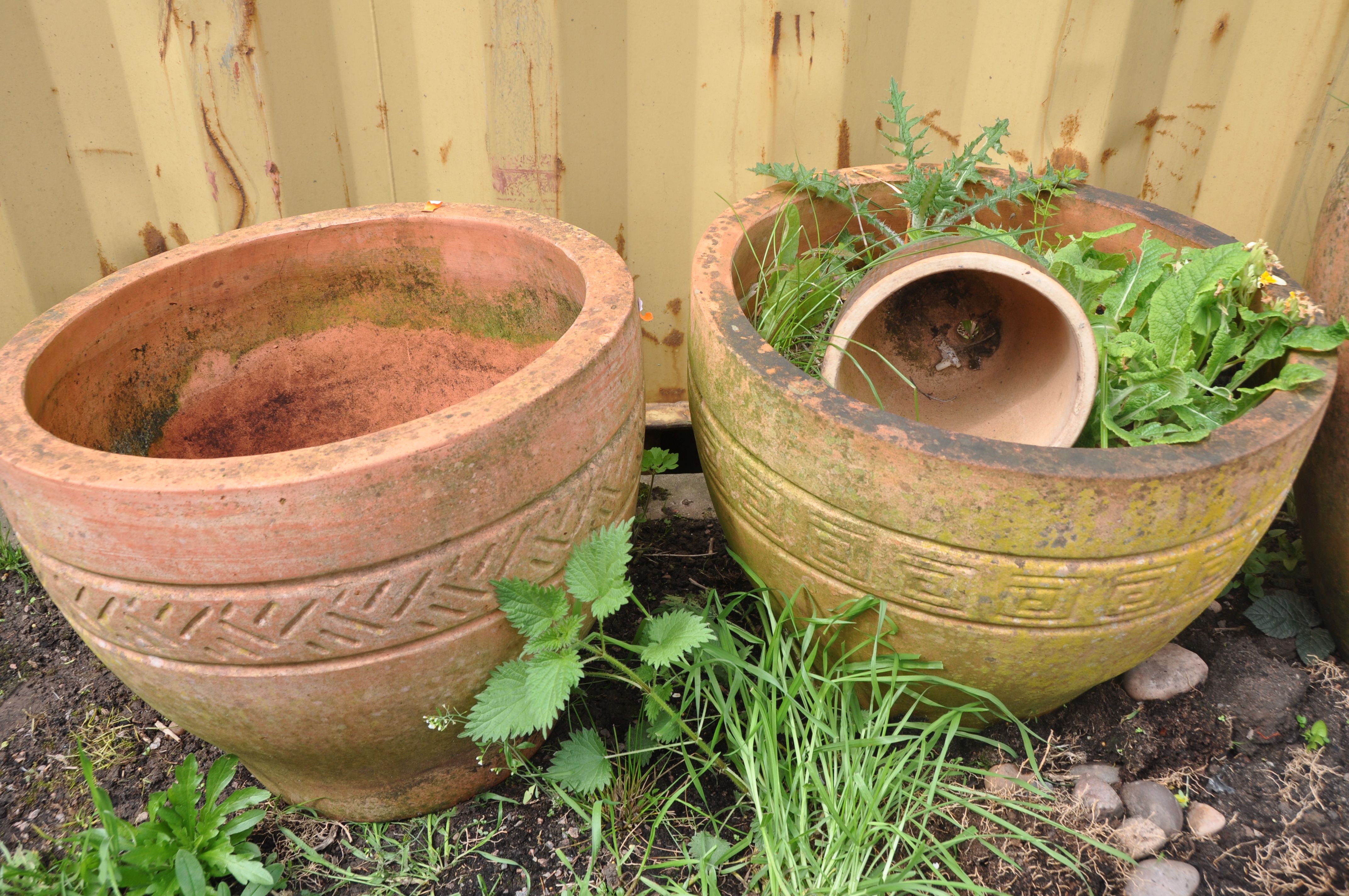 A SELECTION OF WEATHERED TERRACOTTA POTS comprising three circular terracotta pots and a smaller - Image 2 of 4