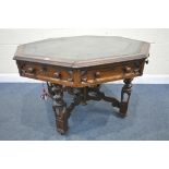 A 19TH CENTURY OAK GOTHIC REVIVAL OCTAGONAL CENTRE LIBRARY TABLE, with a green leather writing