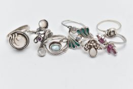 EIGHT WHITE METAL RINGS, various designs some set with semi-precious gemstones such as moonstone,