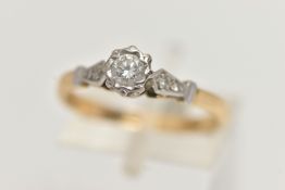 A YELLOW AND WHITE METAL, SINGLE STONE DIAMOND RING, designed with an illusion set round brilliant
