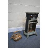 A VINTAGE PETROLUX METAL AND ENAMELLED CONSERVATORY PARAFIN HEATER, along with a square copper