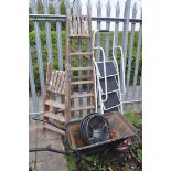 TWO SETS OF WOODEN LADDERS along with a pair of metal steps, wheelbarrow and three plastic hanging