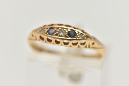 AN EARLY 20TH CENTURY 18CT GOLD BOAT RING, set with three small diamonds interspaced with two