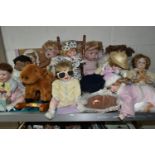 A GROUP OF COLLECTORS DOLLS, twelve baby dolls, including a doll in a crib, a doll on a chair, and a