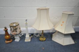 FOUR VARIOUS TABLE LAMPS, to include an Arts and Craft brass lamp, two marble lamps and a rustic