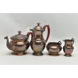 AN ELIZABETH II SILVER FOUR PIECE TEA SET, cast with Celtic inspired border, pouring lips, handles