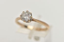 A 9CT GOLD SINGLE STONE CUBIC ZIRCONIA RING, designed a circular cubic zirconia within an eight claw