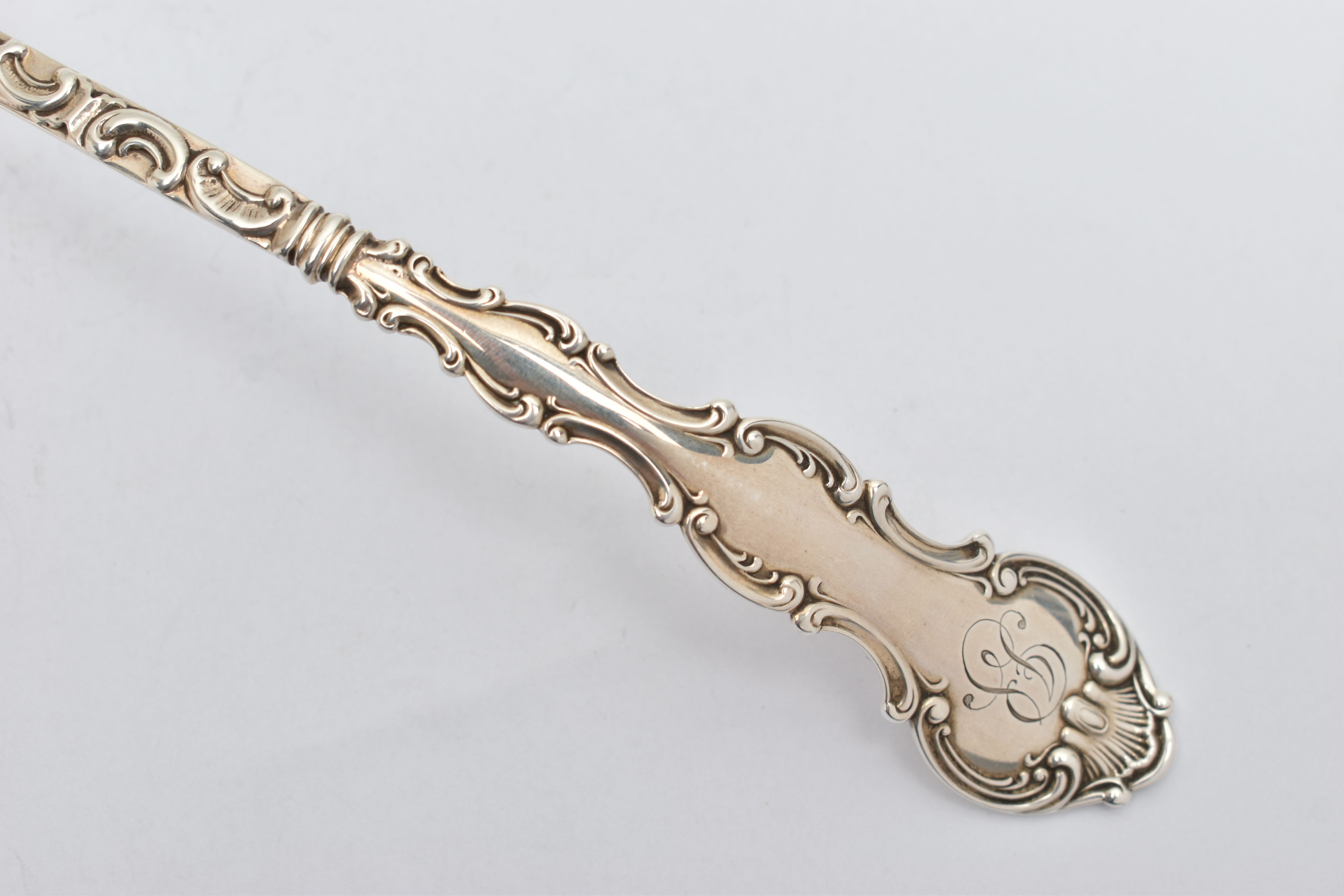 AN AMERICAN STERLING SILVER LADLE, the handle cast with scroll and shell decoration and engraved - Image 2 of 7