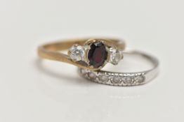 TWO 9CT GOLD GEM SET RINGS, the first an oval cut garnet and two circular cut cubic zirconia,