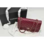 A CHANEL CLASSIC MEDIUM DOUBLE FLAP HANDBAG, with signature diamond quilted lambskin leather