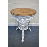 A VICTORIAN STYLE CAST IRON CIRCULAR PUB TABLE, with a mahogany top, diameter 60cm x height 76cm (