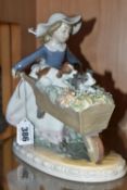 A LLADRO 'A BARROW OF FUN' FIGURE, model no 5460, depicting a girl pushing a wheelbarrow of