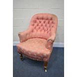 A LATE 19TH/EARLY 20TH CENTURY PINK UPHOLSTERED BUTTONED BEDROOM CHAIR, on oak legs and ceramic