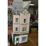 A LARGE WOODEN DOLLS HOUSE 'POPPIES FASHIONS & HABERDASHERY' AND 'WILLOW TEA ROOMS', made by the