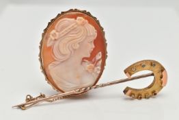 A YELLOW METAL CAMEO BROOCH AND A STICK PIN, the carved shell cameo depicting a lady in profile,
