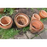 A COLLECTION OF TEN WEATHERED TERRACOTTA POTS of all different sizes largest pot diameter 43cm (10)