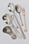 AN ARTS AND CRAFTS PEWTER CADDY SPOON BY JOHN H GREEN AND A FIVE OTHER ITEMS OF FLATWARE, the