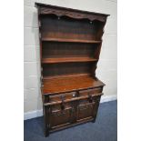 AN OLD CHARM OAK DRESSER, with two drawers and linenfold double doors, width 93cm x depth 43cm x