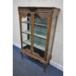 AN EARLY TO MID CENTURY FRENCH WALNUT TWO DOOR DISPLAY CABINET, enclosing three shelves on