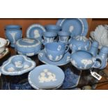 A GROUP OF WEDGWOOD BLUE JASPERWARE, comprising a cup and saucer, cream jug, salt and pepper pots, a