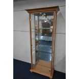 A MODERN BEECH TWO DOOR DISPLAY CABINET, fitted with a single light, width 64cm x depth 32cm x