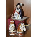 THREE LIMITED EDITION CERAMIC CANDLE SNUFFERS, comprising a pair of Royal Worcester Lion & Unicorn