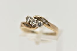 A 9CT GOLD THREE STONE DIAMOND RING, designed with three small round brilliant cut diamonds, each