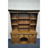 20TH CENTURY OAK DRESSER, top with an arrangement of shelving, over a base of three drawers and