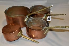 A SET OF FIVE FRENCH COPPER AND BRASS SAUCEPANS, of graduating sizes, diameters 12cm, 14cm, 16cm,