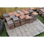 A QUANTITY OF WEATHERED VINTAGE GARDEN/PATHING TILES, in two colours (on a pallet, approx 160)