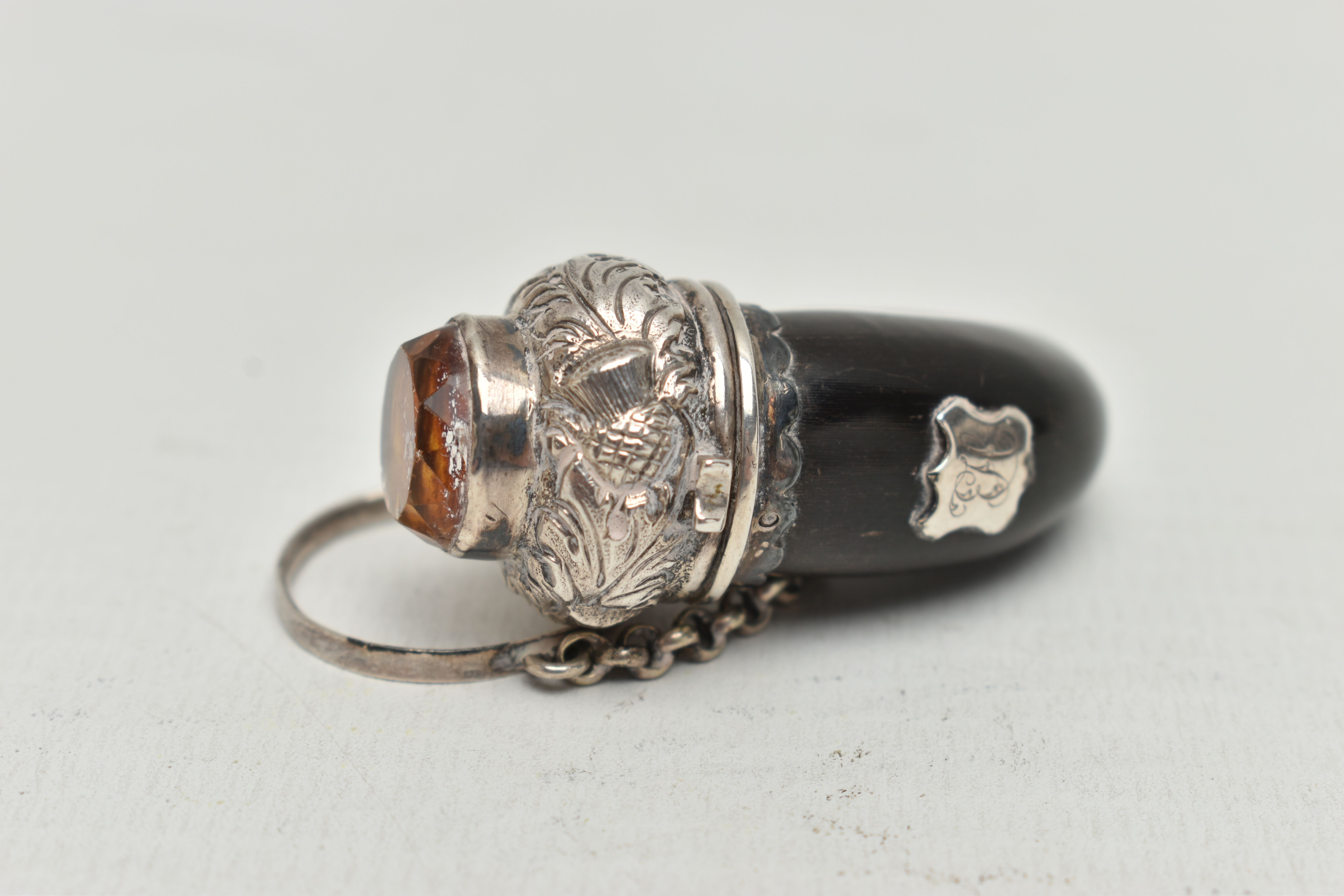 A VICTORIAN SILVER MOUNTED HORN VINAIGRETTE, the hinged cover set with a paste and repoussé