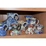 A GROUP OF MASON'S IRONSTONE JUGS, comprising a blue and white 'Willow' pattern pitcher (cracked), a