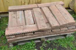 A QUANTITY OF WEATHERED RED COMPOSITE ROPE TOP GARDEN EDGING/BORDER (on a pallet, approx 36)