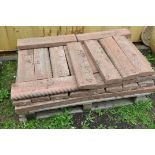 A QUANTITY OF WEATHERED RED COMPOSITE ROPE TOP GARDEN EDGING/BORDER (on a pallet, approx 36)