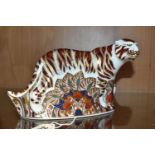 A ROYAL CROWN DERBY 'BENGAL TIGER' PAPERWEIGHT, with gold stopper, red backstamp and date cypher for