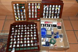 A BOX AND FOUR TRAYS OF THIMBLES, over one hundred and fifty mainly ceramics thimbles by makers