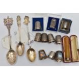 A SELECTION OF SILVER THIMBLES AND TEASPOONS, to include seven thimbles all with full silver