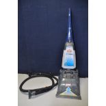 A VAX V-028 CARPET CLEANER with hose and single attachment (PAT pass and powering up)