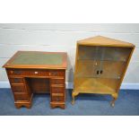 A YEW WOOD KNEE HOLE DESK, with a green leather writing surface and seven drawers, width 77cm x