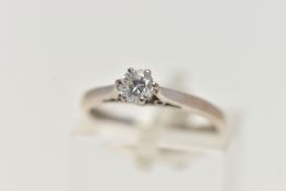 AN 18CT WHITE GOLD SINGLE STONE DIAMOND RING, round brilliant cut diamond in a six claw setting,