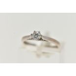 AN 18CT WHITE GOLD SINGLE STONE DIAMOND RING, round brilliant cut diamond in a six claw setting,