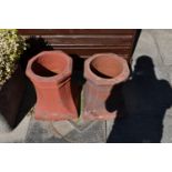 A PAIR OF VINATGE TERRACOTTA CHIMNEY POTS height 43cm Condition some minor losses but no apparent