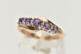 A 9CT GOLD AMETHYST AND DIAMOND RING, designed with a row of graduating circular cut amethyst,